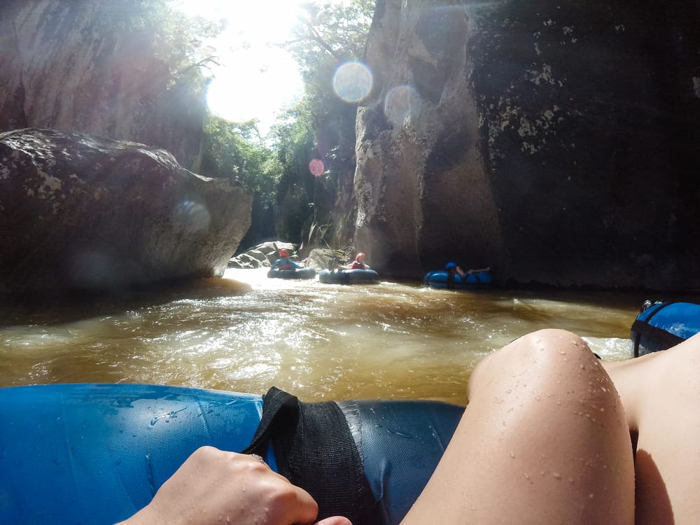 White-water tubing down Rio Blanco canyon rapids
